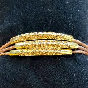 Chico’s 3-strand sparking golden stone bracelet.